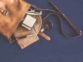 Brown Leather Crossbody Bag With White Framed Sunglasses