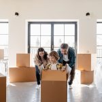 A Couple Looking at their Son Inside the Box