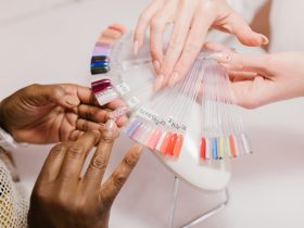 A Client Choosing on a Nail Color Palette