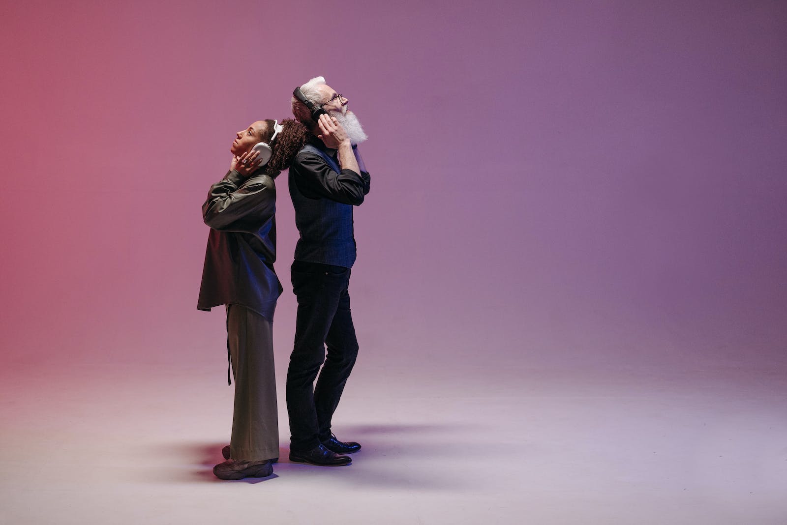 A Man and a Woman using Wireless Headphones