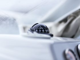 closeup photography of vehicle compass