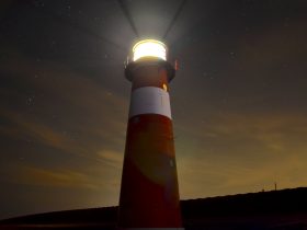 low angle view of red and white lighthouse